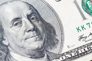 Macro close up of Ben Franklin's face on the US $100 dollar bill.