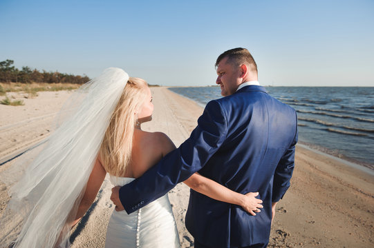 couple in love on the beach on their wedding day