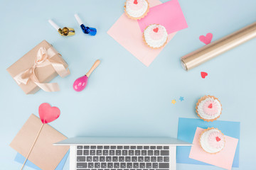 top view of cakes with laptop and party horns with beanbag mock-up, birthday party