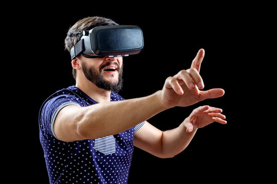 Young happy man experiencing virtual reality