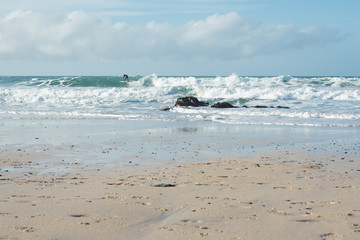 Lone surfer catching a wave