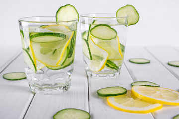 Refreshing  cucumber  cocktail, lemonade, detox water  in a glasses on a white background. Summer drink. 