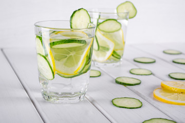 Refreshing  cucumber  cocktail, lemonade, detox water  in a glasses on a white background. Summer drink. 