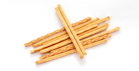 Heap of salty sticks isolated on white background