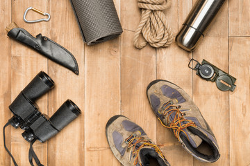 Traveler set on wooden background, flat lay