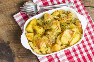 Baked potato, roasted potatoes with rosemary. Selective focus