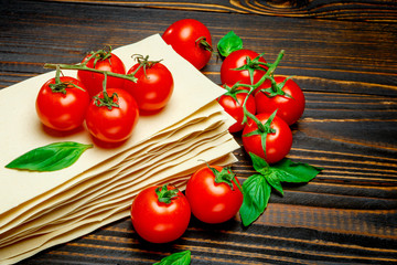 dried uncooked lasagna pasta sheets and tomato