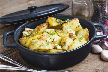 Baked potato, roasted potatoes with rosemary. Selective focus
