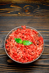 Minced meat of stuffing in glass bowl