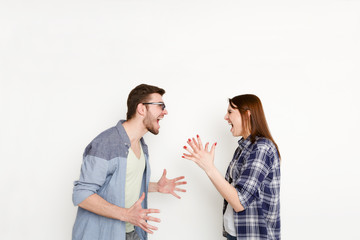 Fototapeta premium Relationship problems, young couple arguing, isolated