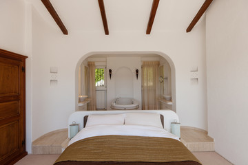 Elegant bedroom with bath tube