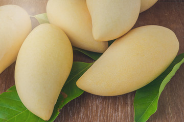 mango fruit on wooden background
