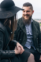Young modern hipster couple in love. Deep moment of a love story with a vintage look