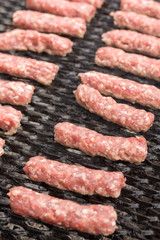 Grilling minced meat kebabs on the barbecue flat lay