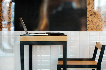 Equipment of freelance graphic designer on the table at the cafe