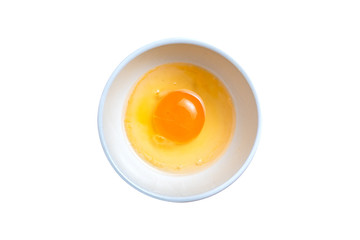 Egg yolk and white in a bowl isolated on white background