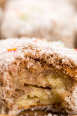 Sliced chocolate cakes with coconut closeup macro
