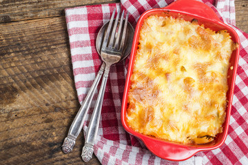 Bacon lovers' mac and cheese in baking dish Cheese face