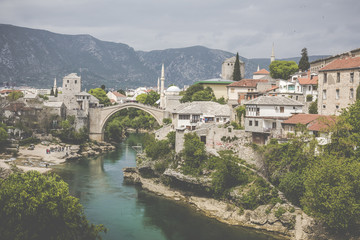 Fototapeta na wymiar Panorama of The Old Bridge in Mostar in a beautiful summer day, Bosnia and Herzegovina