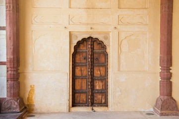 Fototapeta na wymiar Wooden doors medieval design with arch - Closed Wood Door