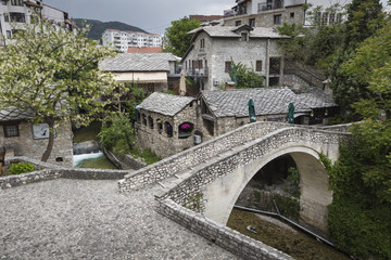 Fototapeta na wymiar Panorama of The Old Bridge in Mostar in a beautiful summer day, Bosnia and Herzegovina