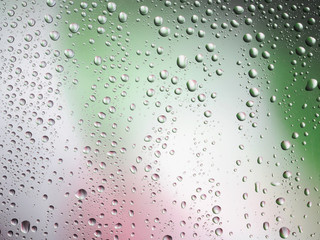Water drops color background rain glass space rainbow.