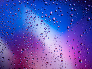 Water drops color background rain glass space rainbow.