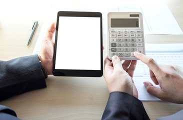 Businessman analysis on calculator, new plan financial graph data with business colleagues using digital tablet for estimation at the office, invesment concept