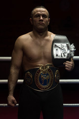 Fototapeta na wymiar kick boxer with his championship belt