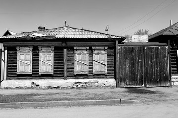 Ancient wooden house in black and white tones