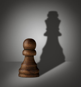 chess pawn with shadow shaped as a king