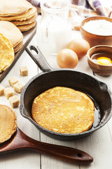 Homemade pancake in the frying pan on the table