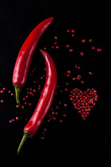 Red chili pepper on a black background