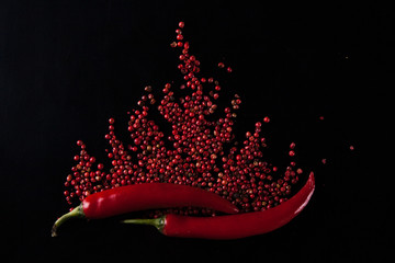 Red chili pepper on a black background