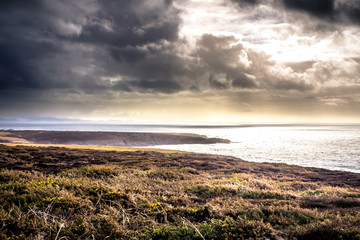 Sunshine breaking through clouds