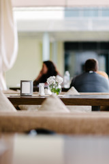 Vase with flowers in a cafe