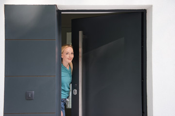 woman opening her house door