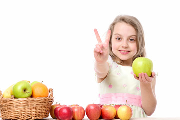 Fototapeta na wymiar little happy girl or cute hungry child eating colorful fruit