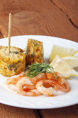 Mediterranean dish of shrimps with corn cobs. Dish of fresh, ecological clean products