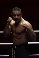 Fototapeta na wymiar professional kickboxer in the training ring