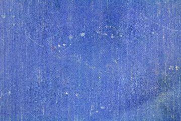Old blue textile texture with fading and spots. Abstract background