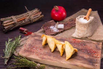 Arab home-made spinach pies and grains of pomegranate
