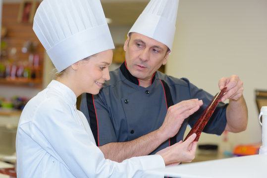 team of professional chef in modern restaurant