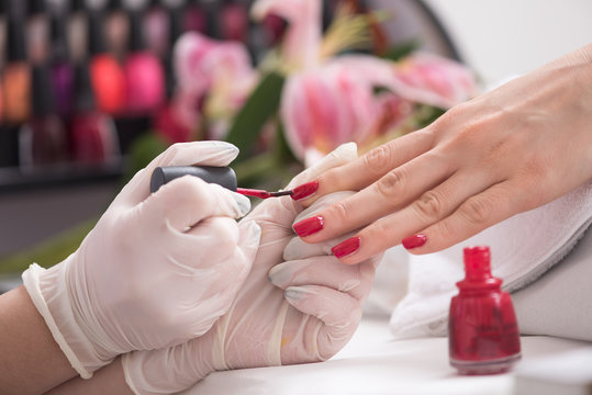 Woman hands receiving a manicure