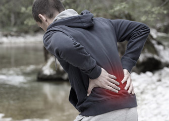 Sport injury, Man with back pain. Pain relief and health care concept.