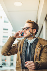 Man calling by mobile phone. Businessman using a mobile phone. Man sending a message by smartphone