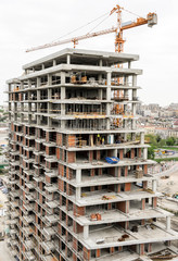 Building of large modern apartment scraper on the construction site