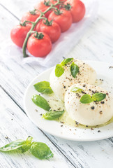 Mozzarella with cherry tomatoes and basil leaves