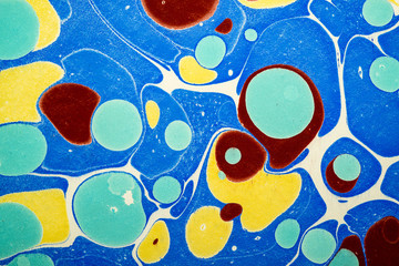Ebru art. Traditional Turkish Ebru technique. Painting on water, followed by paper prints. Color...