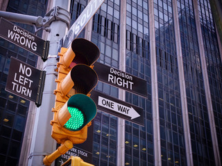 NYC Wall street yellow traffic light black pointer guide one way green light to Right decision way,...